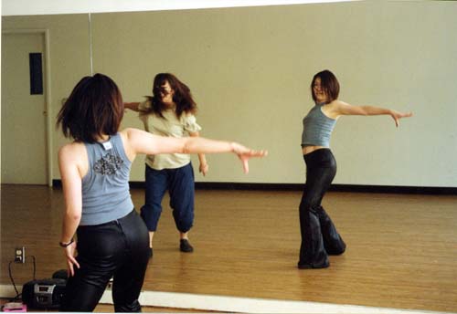 -Photo by Roderick DanielsNamoi Nakamura, foreground, and Izumi Takiguchi dance in front of a mirror.