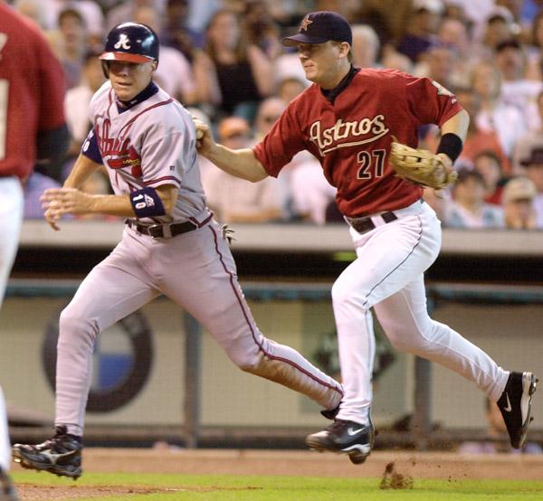 Photos by Associated Press
Atlanta Braves Chipper Jones, left, is tagged out by Houston Astros third baseman Geoff Blum (27) as he is caught in a rundown after trying to score from third on a ground ball by Keith Lockhart during the fourth inning