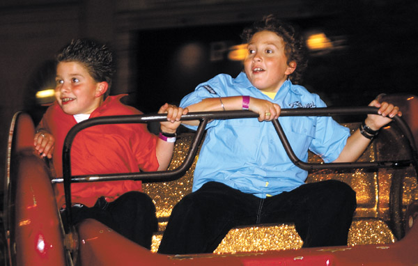 Jennifer Soliz/Daily Texan Staff
Spy Kid Daryl Sabara, right, takes a ride at Sunday's Spy Kids 2 premiere.