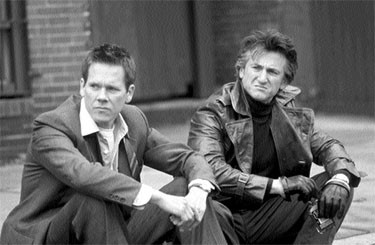 Kevin Bacon, left, and Sean Penn, right, in the film Mystic River.