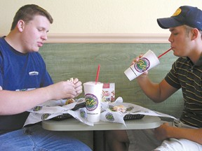 Sean Wilson (left) and Blake Griffis (right) eat at Tropical Smoothie. Photo by: Kristin Gerlach