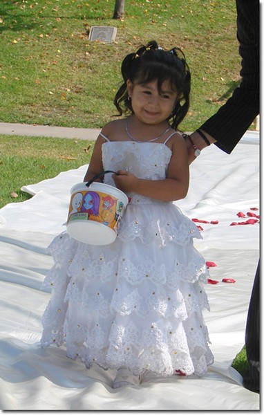 This flower girl may someday serve at her aunt's wedding.
