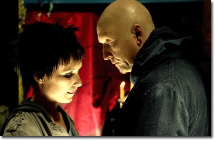 Jigsaw, played by Tobin Bell, prepares his aprrentice, Amanda (Shawnee Smith), for their latest kill.