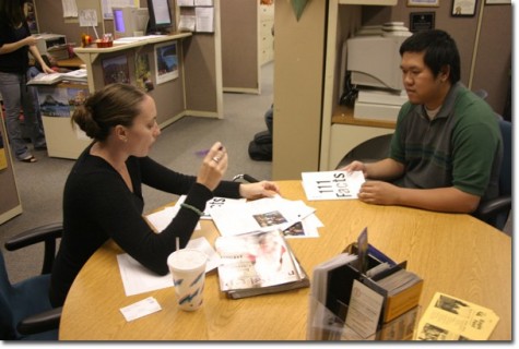 UC Riverside representative Jolene Tuz assists Binn Le, a 21-year-old business major. 