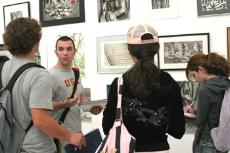 Students in Trudi Abram's art history class stopped by the artists reception on May 17 to analyze some of the pieces on display.