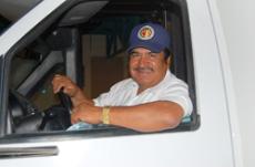 Froiland Valencia keeps staff and students moving in his capacity as campus shuttle bus driver.