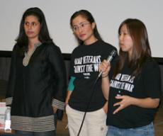 Veterans Maricela Guzman, 30, left; Wendy Barranco, 22, and Jane Song, 23, with microphone, field questions from the audience during the Womens History Month event.