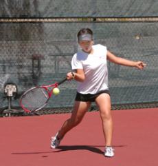 Lady Vaquero tennis player Miyuki Yokozuka gives it her all in the April 10 match against Ventura college.