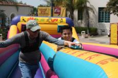 Joseph Barbara, left, and Jimmy Lam duke it out in a Bungee Run competition at the Inter Organizational Council Olympics in Plaza Vaquero on April 1.