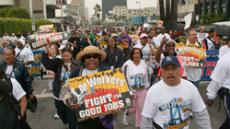 More than 100 workers joined in a Hollywood in the Docks March on Wilshire Boulevard April 15.