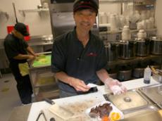 Luke Park, manager of the family-owned Flame Broiler, participates in all aspects of running the business. 