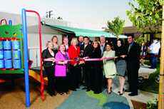 AFFORDABLE CHILD CARE: Cutting the ribbon on the new playground are, from left,  trustee members Ann Ransford and Armine Hacopian, Karen Holden-Ferkich, trustee President Dr. Vahe Peroomian, Interim President Dawn Lindsay, trustee Vice-President Anita Qui