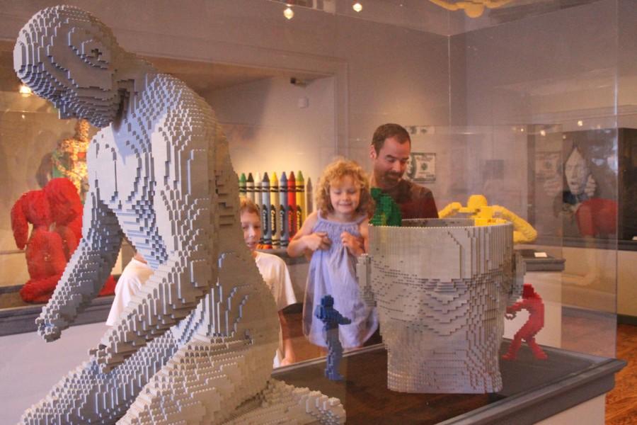LEGO+ART%3A+Casey+Wolfe%2C+a+producer%2C+holds+his+daughter%2C+Emma+Wolfe+up+to+view+the+sculpture+made+entirely+out+of+Lego+blocks+by+Nathan+Sawaya+on+exhibit+at+the+Forest+Lawn+Museum+Friday.+