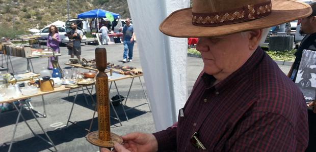 SWAP MEET VENDOR: Gary Hart sells calendars and collectible toys at the May 19 swap meet in the GCC parking lot C.