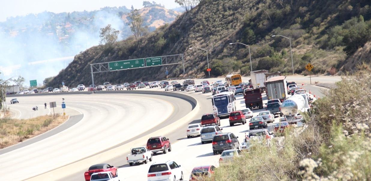A brush fire between the 134 and 2 freeways closed a section of the 2 freeway in both directions Friday.