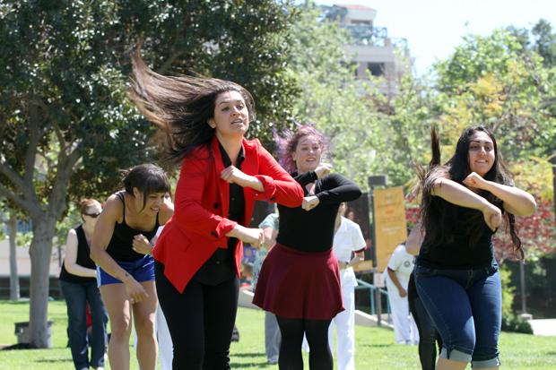 
Student Services Technician Suzanna Sargsyan leads students, friends and faculty in a choreographed remix of Uptown Funk. Media Arts students were on hand to film the event on Monday at Plaza Vaquero..
 