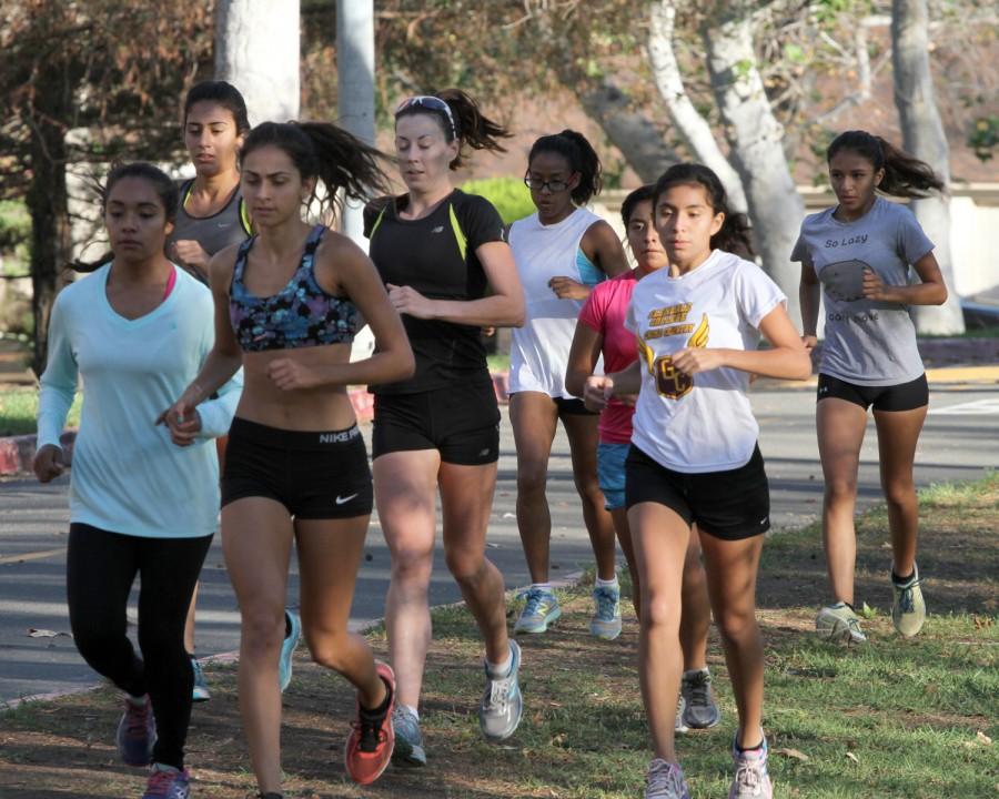 LEADING+THE+PACK%3A+Women%E2%80%99s+Cross+Country+team+captain+Crystal+Morales%2C+front+left%2C+keeps+up+with+Leana+Setian+while+training+with+the+team+at+Verdugo+Park+before+the+state+championships+where+the+Lady+Vaqs+took+their+11th+straight+title.+Setian+is+ranked+%231+in+Southern+California.