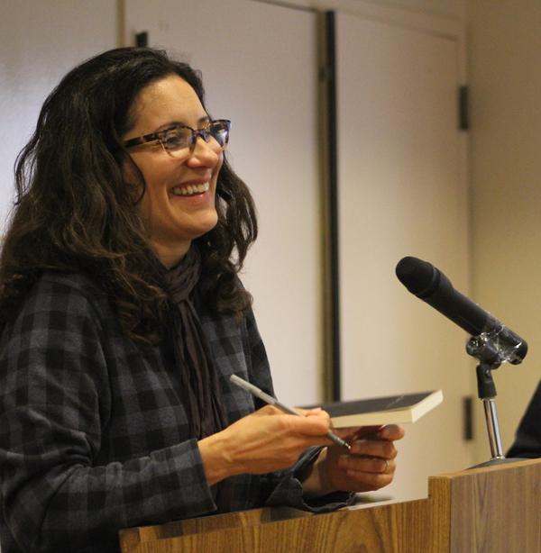WRITER SPEAKS: Janet Sarbanes signs a student’s copy of “Army of One,” top, and answers questions from the audience at an author reading and Q & A on Friday, April 8 at the Student Center.