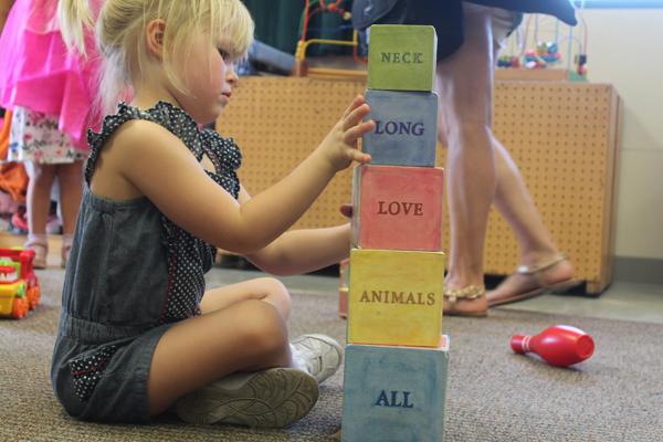 Olivia Rogerson plays with building blocks at the Child Development Center in Glendale, Calif, on Monday, Sept. 26, 2016. She enjoys stacking the blocks and creating silly sentences. (Tess Horowitz/J110)