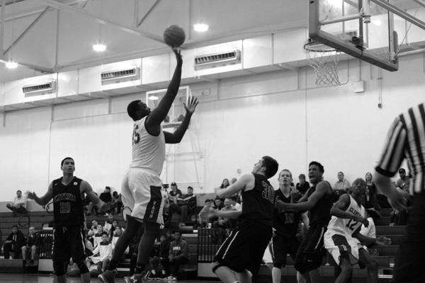 THE BIG MAN: Vaquero Ange-Michel Kuo gets an easy two on a shot from the center of the key in the game against Citrus on Saturday. The Vaqs will face L.A. Valley tonight at 5 p.m.