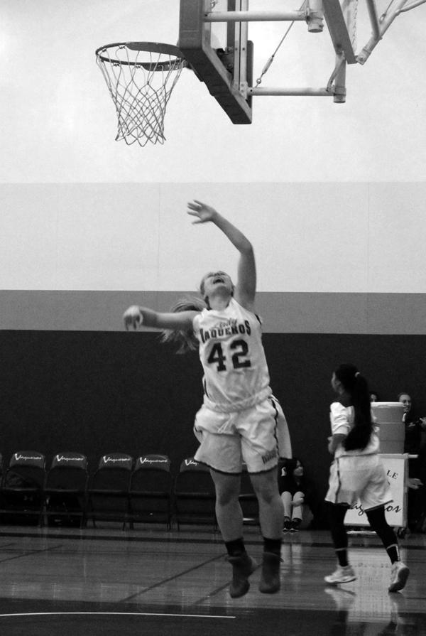 WARM UPS: Lady Vaqs forward Brooke Radcliff leaves the floor for a layup before the game against Citrus Friday. The Vaqs won 52-44.