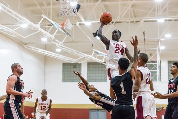 Serigne Athj, No. 24, finishes through contact against Pierce Colleges team.