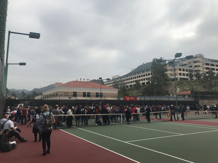 Students, staff and faculty gather at the GCC tennis court as part of the emergency fire drill on April 3.
