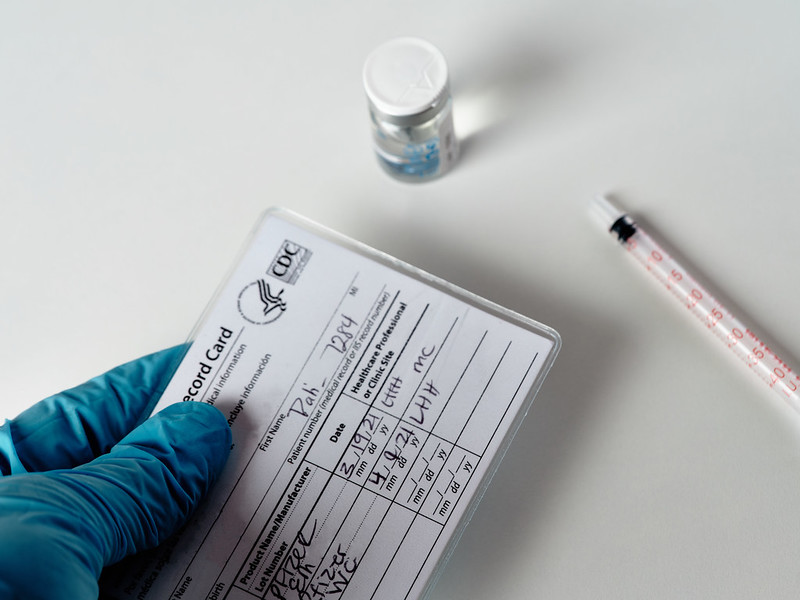 A COVID vaccination card in a medical clinic.