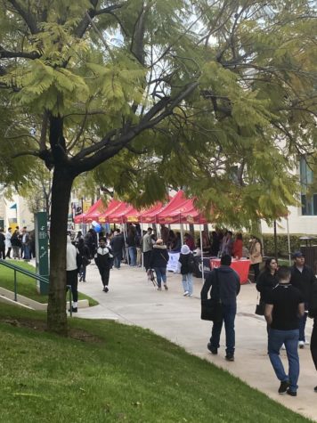 Students and community members attend the March 2023 job fair. This photo is taken on Vaquero Plaza, in front of the Administration Building. 